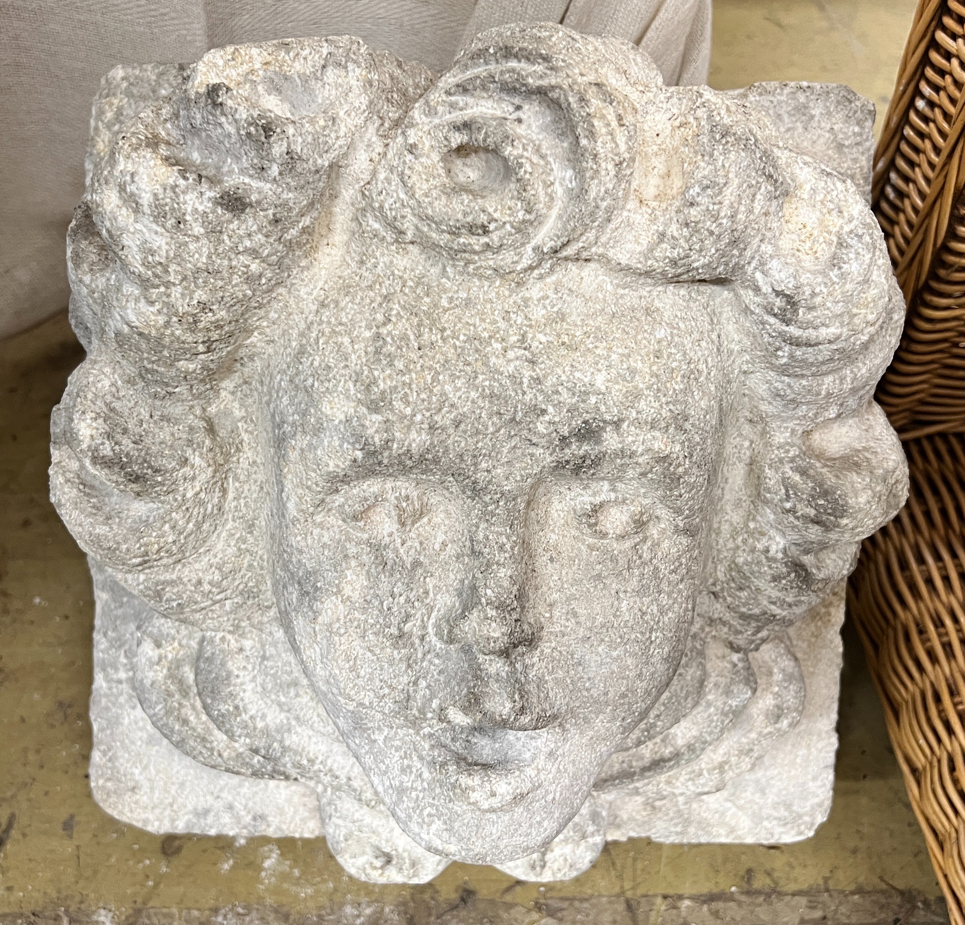 A stone carved corbel, width 30cm, depth 23cm, height 30cm